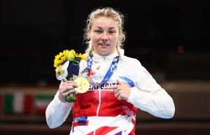 TOKYO, JAPAN - AUGUST 08:  Lauren Price of Team Great Britain celebrates with her gold medal during the medal ceremony for the Women's Middle (69-75kg) Final bout between Lauren Price of Team Great Britain and Qian Li of Team China on day sixteen of the Tokyo 2020 Olympic games at Kokugikan Arena on August 08, 2021 in Tokyo, Japan. (Photo by Buda Mendes/Getty Images)